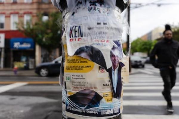 Posters in English and Spanish on a telephone pole in Bushwick, New York on May 23, 2024.