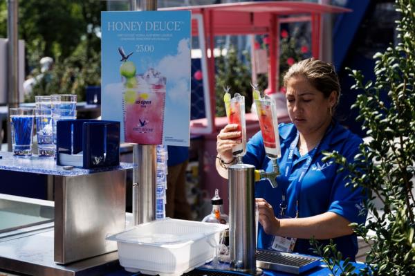 Bartender pouring Ho<em></em>ney Deuce cocktails at the 2024 US Open Champio<em></em>nships in Flushing, New York