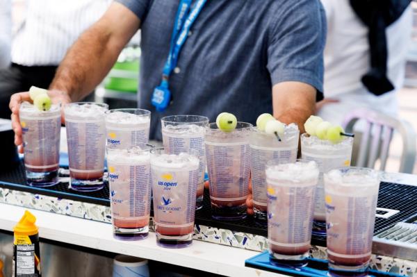 Bartender pouring Ho<em></em>ney Deuce cocktails at the 2024 US Open Champio<em></em>nships in Queens, New York