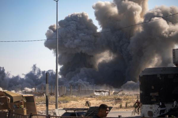 Smoke rising from an Israeli airstrike in Khan Younis, southern Gaza Strip