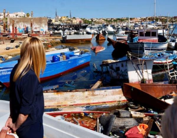 Meloni looking at boats used by migrants in Lampedusa in September 2023.