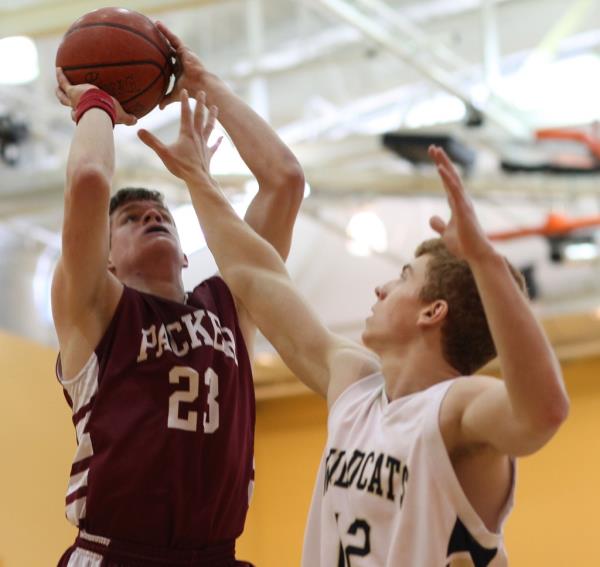 Morton (left) playing in a basketball game for the high school on March 4, 2012.