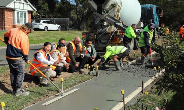 Council officers and the RMIT research team were present for the pour of the coffee co<em></em>ncrete for the footpath trial in Gisborne. Credit: Bodey Dittloff, Macedon Ranges Shire Council 