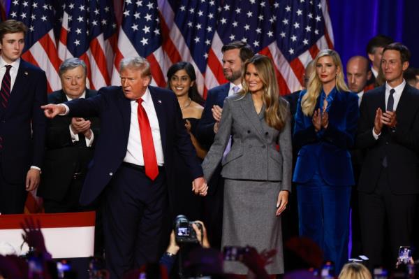 Trump on stage with family members, friends and campaign officials at the watch part in West Palm Beach on Nov. 6, 2024.