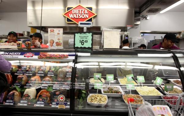 Dietz & Watson cold deli counter during Fiesta Market Place grand opening in Houston, retailing variety of cold cuts despite listeria risk perceptions.