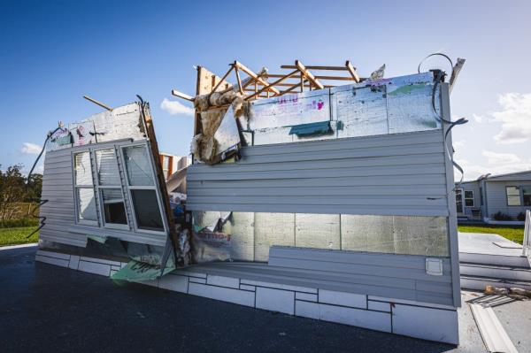 A damaged home in the Tropical Harbor Estates mobile home park sits in need of repairs.