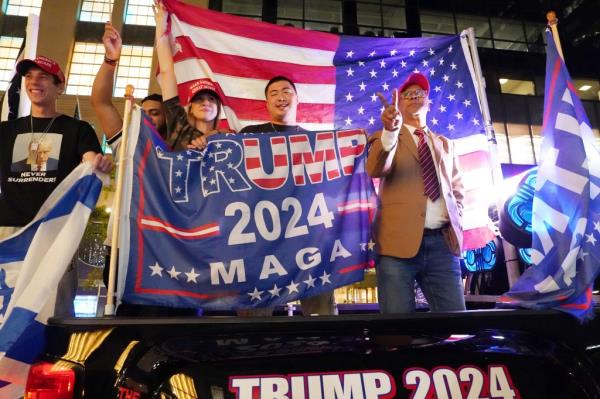 Trump supporters celebrate outside of Trump Tower in New York, NY on November 6, 2024.