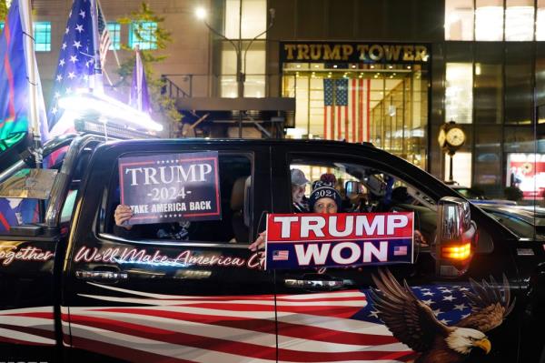 Trump supporters celebrate outside of Trump Tower in New York, NY on November 6, 2024.