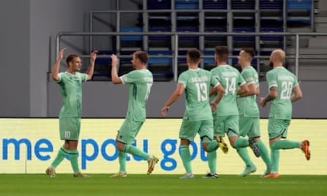 Belarus players celebrate a goal against Slovakia in 2022.