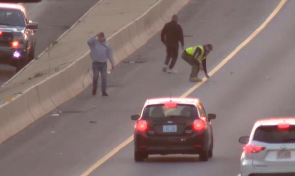 People were seen chasing down dollar bills on I-95 Wednesday morning.