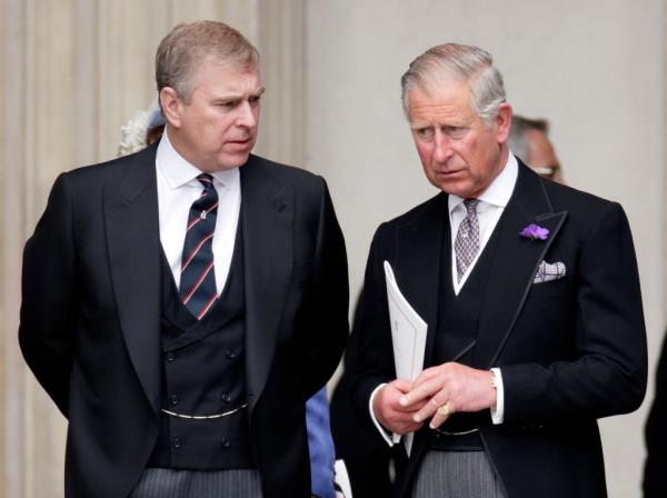 Prince Charles and Prince Andrew in suits attending Queen Elizabeth II's Diamond Jubilee celebration at St Paul's Cathedral, London, 2012