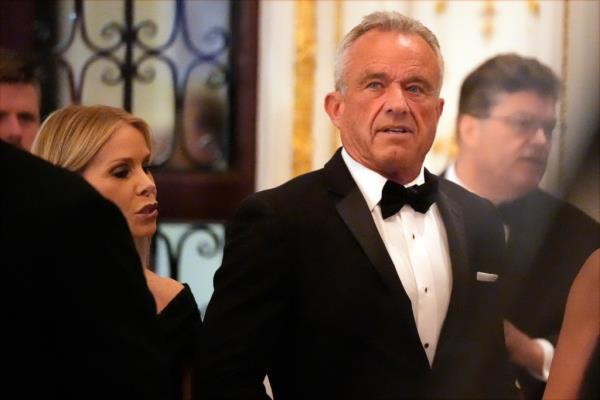 Robert F. Kennedy Jr., and his wife Cheryl Hines arrive before President-elect Do<em></em>nald Trump speaks during an America First Policy Institute gala at his Mar-a-Lago estate, Thursday, Nov. 14, 2024, in Palm Beach, Fla.