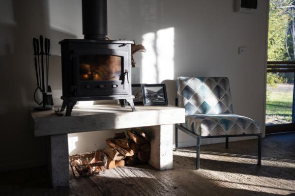 Enjoy the warmth by a roaring fire in Barn at Farm at Freeburgh.