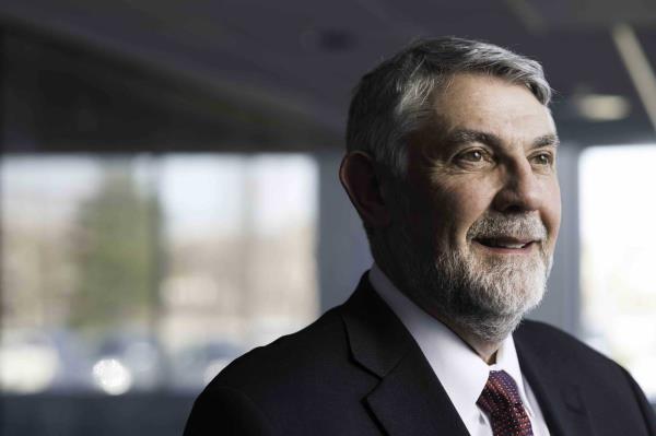 Close up of Christopher Deeney, director of the University of Rochester Laboratory for Laser Energetics, looking off-camera.