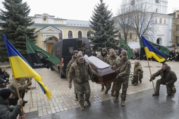 Ukrainian servicemen carry the coffin of combat medic Maria-Khrystyna Dvoinik, who was killed during an evacuation of wounded soldiers from the front line in Donetsk