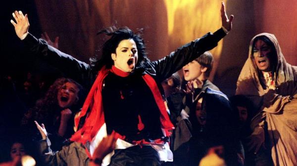 Pulp's Jarvis Cocker invaded the stage during Michael Jackson's performance of Earth Song at the Brit Awards in 1996. Pic: Reuters