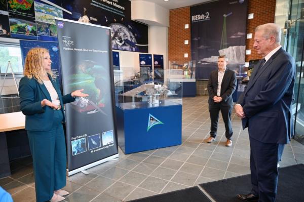 Christa Peters-Lidard, NASA Goddard's Sciences and Exploration Directorate director (left), speaks with Gore in the lobby of Building 32, wher<em></em>e the former vice president viewed the co<em></em>ntrol room of NASA's Plankton, Aerosol, Cloud, ocean Ecosystem (PACE) mission.